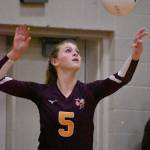 White River sophomore Elle Thomas prepares to serve during a Hornet home match. File photo by Kevin Hanson