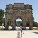 …celebrating in front of a Roman arch….
