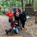 Volunteers help out at a Sunday work party at Rooster Haus Rescue in Fall City. From left, top: Jenny Rae, Littles the dog, Nikki Waters, John Higgins, Gina Erskine. From left, bottom: Yoshi the dog, Ashley Ventura, Manny the rooster. Natalie DeFord/staff photo