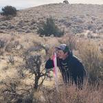 Hunter Schumacher determines the slope of the land. Contributed photo