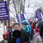 The threat of rain didnt seem to deter St. Elizabeth picketers, who, after picketing for more than an hour, held a small rally with speakers to inform people about the unions issues with CHI Franciscan. Photo by Ray Miller-Still