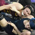 White Rivers Claire DiCugno returns for another season on the mat. In this photo from last years state meet, she handles an opponent on the way to a second-place finish. File photo by Kevin Hanson
