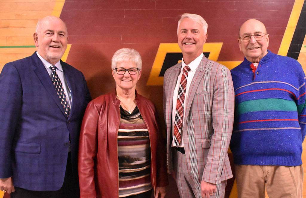 Merrill is joined by superintendents Art Jarvis, Nelson, and Jim Barchek. Photo by Kevin Hanson