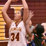 Marissa Espinosa works under the basket during Enumclaws easy victory of Kent-Meridian. Photo by Kevin Hanson