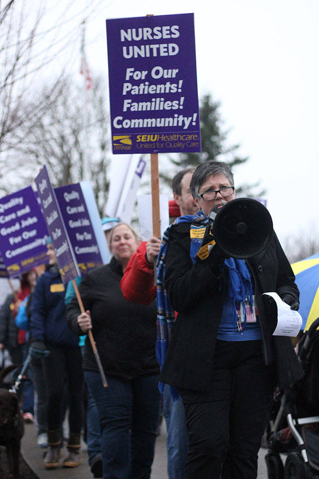 St. Elizabaeth nurses took to the streets Dec. 4, 2019, for an information picket line. SEIU Healthcare 1199NW, their union, aided their effort with a mobile billboard that drove around Enumclaw. Photo by Ray Miller-Still