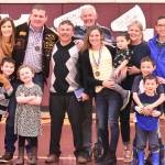 Gathering for a group photo Friday were Ty Watterson, his wife Megan, kids Sam and Macy, and his EHS coach Lee Reichert. Joining Alison Tubbs Mandi were her husband Mark, children Nathan, Tyler and Zach, and her parents Tim and Nancy. Photo by Kevin Hanson