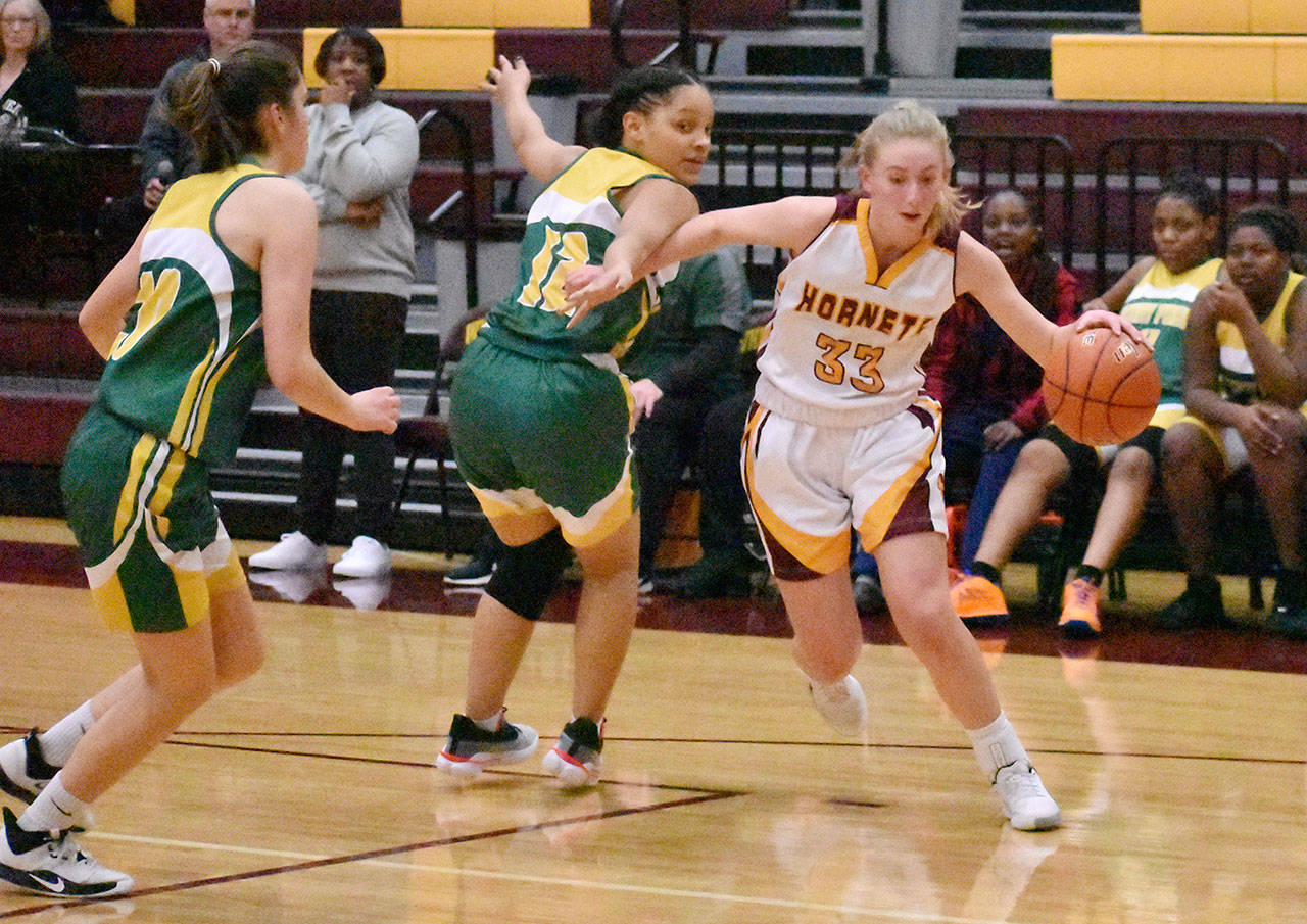 White River sophomore Brooke Mahler drives to the hoop during Friday nights lopsided Hornet victory over the visiting Foss Falcons. Photo by Kevin Hanson