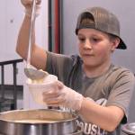 Danner Osborn was one of many servers at the recent Empty Bowls event in Enumclaw. He served with Trinity Lutheran Youth Group. Photo by Kevin Hanson