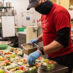 Dan Kiley, executive chef at Lisa Dupar Catering, prepares Mediterranean salads for Medic One Foundations Gratitude Meals program. Photo courtesy of Hannah Sheil