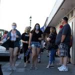 The downtown cruise on Friday, May 9, was aimed at helping local restaurants. However, many people appeared to just be content standing in groups on the corner watching the parade of cars, although it seemed most did not social distance or use personal protective gear. Photo by Ray Miller-Still