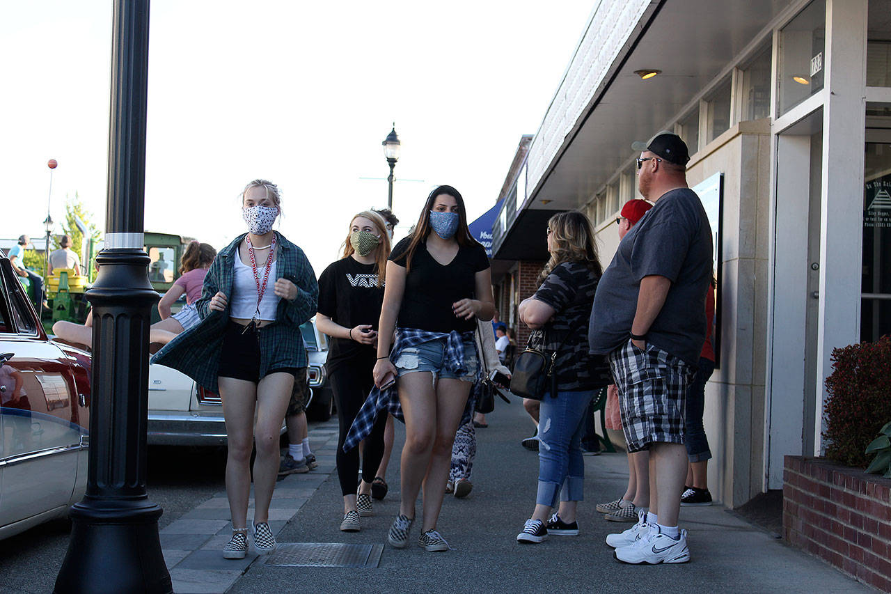 Some people wore face masks when the city of Enumclaw recently had a downtown cruise where people drove around downtown to order food from local restaurants. RAY MILLER-STILL, Enumclaw Courier-Herald