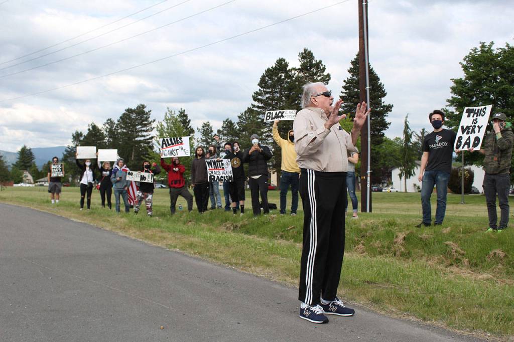In one of the few incidents at local protests, a driver pulled over on SR 410 to argue with demonstrators, who said he did not need to engage and chanted until he left in clear frustration. Photo by Ray Miller-Still