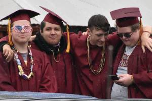 Enumclaw Highs graduating class of 2020 was honored with a parade and concert Monday afternoon at the Expo Center. The event was put together in a week, following a phone call from country artist Drew Baldridge. More than 200 vehicles gathered on the midway, filled with grads, family and friends. After Baldridge performed three songs, the crowd was led from the Expo Center by grad Cooper Hanson in a John Deere tractor. Photo by Kevin Hanson