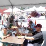 Sundays on Cole sees some of the normal weekend action return to downtown Enumclaw, but while restaurants and retailers see a boost in their sales, some worry the novelty of the weekly event will soon wear off. Photo by Ray Miller-Still