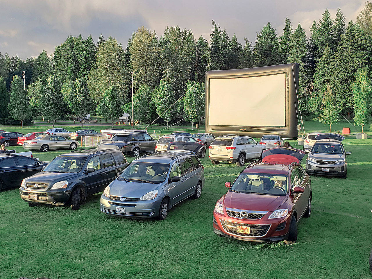 The Enumclaw Expo Centers drive-in movies are shown on a 40-foot screen, with audio put through the radio. Photo by Ray Miller-Still