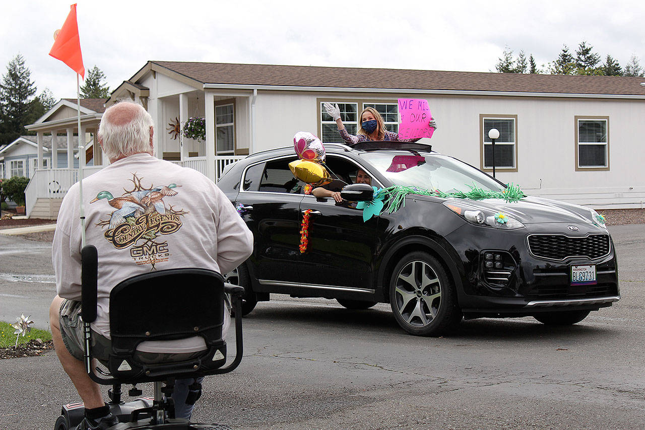 The Enumclaw Senior Center paraded around Enumclaw on May 14 to say hi to seniors stuck at home due to the coronavirus. Photo by Ray Miller-Still