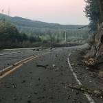 Downed power lines and loose rocks normally held by tree roots keep the highway east of Enumclaw unsafe for drivers. Image courtesy Department of Transportation