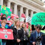 Dissatisfied residents hold signs in protest of comprehensive sex education mandate. Cameron Sheppard/ WNPA News Service