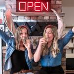 Venise Cunningham and Belinda Kelly celebrating the opening of their new restaurant and bar, the Simple Goodness Sisters Soda Shop in Wilkeson. Contributed photo