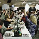 One of the highlights of Holiday Fantasy has been outright donations to a worthy cause. Here, attendees show their support during the 2018 event. This year, the event will be holding a virtual auction over four days. Photo by Kevin Hanson