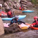 Courtesy photo
Eleanor Knight, 14, and her younger brother, Ivan, then, 9, horse around while waiting to surf a wave on the Class III Wenatchee River.