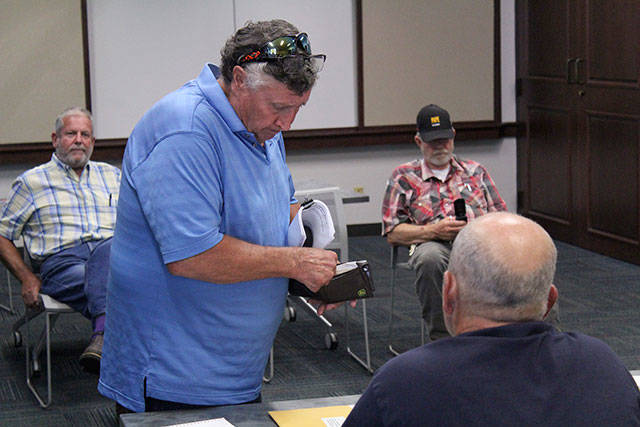 Allan Thomas attended an Aug. 27, 2019 Drainage District 5 meeting with its three new commissioners in order to help them figure out how to set their yearly budget and provide them other information. Photo by Ray Miller-Still