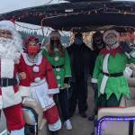 Pictured left to right is Bill Swedberg (Santa), Jan Capetto (Mrs. Claus), Cara Porter (elf) Scott Sherer (captain), Jonny Hoefig (gaffer), and Sue Sherer. Photo courtesy Lauren Landis