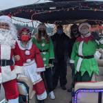 Pictured left to right is Bill Swedberg (Santa), Jan Capetto (Mrs. Claus), Cara Porter (elf) Scott Sherer (captain), Jonny Hoefig (gaffer), and Sue Sherer. Photo courtesy Lauren Landis
