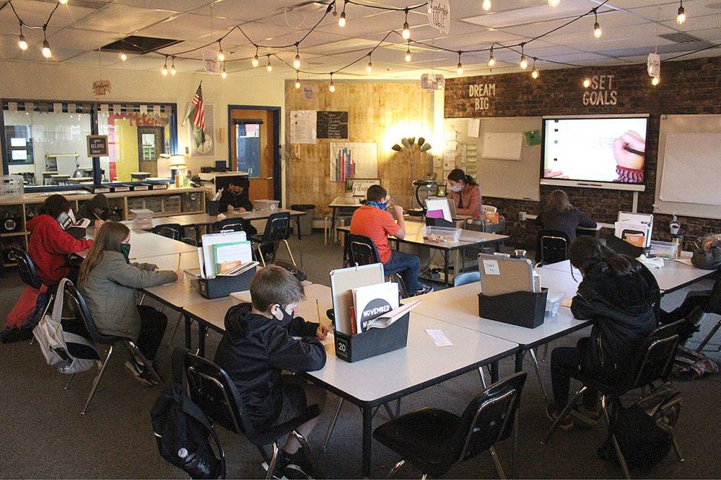 Classes like Ms. Vail's at the White River School District's Foothills Elementary are now split in half in order to promote social distancing. Also pictured is Daniel Franco, Waylon Sinkovic, Chase Caldwell, Jakaylah Holt, Skylar Pearce, Collin Smith, Diana Torres-Silva, Kinley Short & Lillian Clay. Photo by Ray Miller-Still