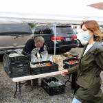Instead of traditional farmers markets, shoppers pre-order their food from vendors like Robin Hones of Cascadia Greens, who then package up the order and drop it off in your car on market day. Photo by Ray Miller-Still