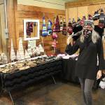Kim Smasne says many people first think the hats she makes are just for kids, but that they often change their minds after trying one on. When you put these on, youre going to feel funky, fun, flirty  and Im not just saying that to sell you a hat, she said. In this picture, Smasne is selling her wares at Enumclaws Friday Night Market. Photo by Ray Miller-Still