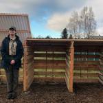 Devin Tompkin stands next to the compost bin he built for the Buckley Mountain View Community Garden. Courtesy photo