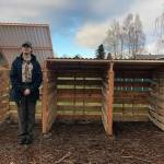 Devin Tompkin stands next to the compost bin he built for the Buckley Mountain View Community Garden. Courtesy photo