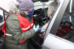 More than 60 Pierce County health department staff and volunteers helped vaccinate 600 people at White River High School over the weekend. Photos by Ray Miller-Still