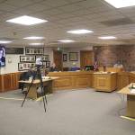 Most of the council met in person on Feb. 22, with applicants for the two open seats on the council interviewing for those positions virtually. Pictured on the screen is Julie Johnson. Photo by Ray Miller-Still