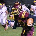 White River's offense received a second-half spark from quarterback Yaz Metzenberg, shown here running for a first down. Photo by Kevin Hanson