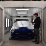 Josh Sanders shows off a vehicle on March 5 in the paint shop of his Enumclaw auto shop thats received repairs and a really tricky tri-coat metallic paint job. Photo by Alex Bruell