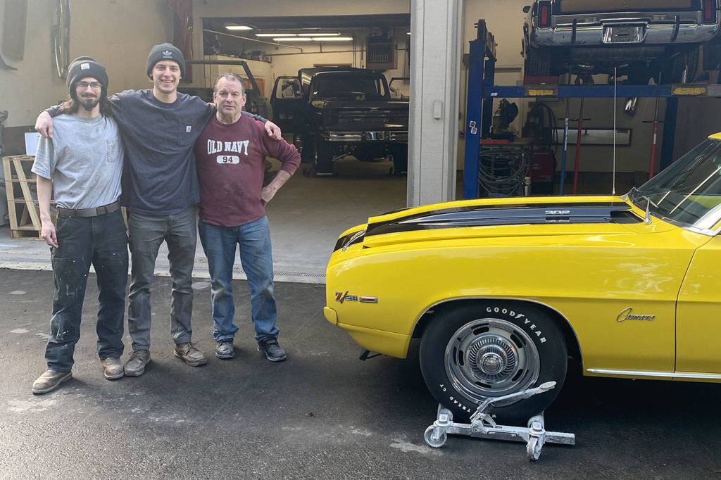 From left to right: Matt Anderson, Josh Sanders and Doug Isbell pose for a picture outside Sanders Street Rods in Enumclaw. Photo courtesy Josh Sanders