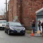 Customers of the Buckley Plateau Market line up in an alley way to receive their orders. Photo courtesy Sean Shands