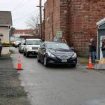 Customers of the Buckley Plateau Market line up in an alley way to receive their orders. Photo courtesy Sean Shands