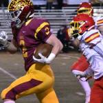 Enumclaw High's Royal Snyder outruns Mount Tahoma defenders during the early stages of Friday night's lopsided Hornet victory. Photo by Kevin Hanson