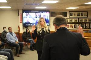 Corrie Koopman Frazier being sworn in.