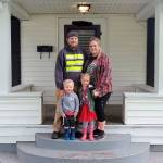 Luke, Sarah, Remi, and Ryker Lenihan in front of their new home. Contributed photo