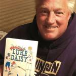 courtesy photo / Courier-Herald
Enumclaw author Matthew McCully holds a copy of his 2019 book The Legend of Luke Daisy.