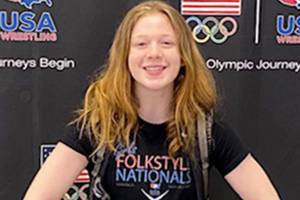 Shelby Moore shows off some of the impressive hardware she earned during a championship effort at wrestling nationals. Submitted photo