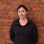 Erica C. Barnett, a Seattle journalist whose coverage includes city hall, homelessness and transportation, poses for a picture outside her Pioneer Square neighborhood office. Barnett was one of several speakers during the April 13 King County Conference on Addiction Disorders. Photo by Alex Bruell