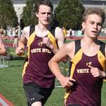 A trio of White River runners complete a first lap on the track. Photo by Kevin Hanson