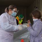Emma Miller testing herself for coronavirus at the Enumclaw testing site. Photo by Ray Miller-Still
