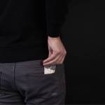 "A man takes out a plastic bag from a pocket with a dose of cocaine or another concept of drugs." Photo courtesy Marco Verch, licensed under CC BY 2.0