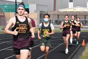 Enumclaw track and field athletes easily ran past Foss High the afternoon of April 28. Because the Falcons brought few competitors to the EHS campus, some of the races had males and females running together. Photo by Kevin Hanson